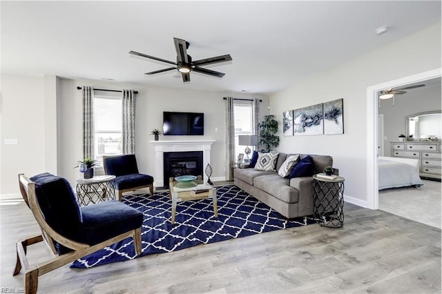 living room featuring hardwood / wood-style flooring and ceiling fan