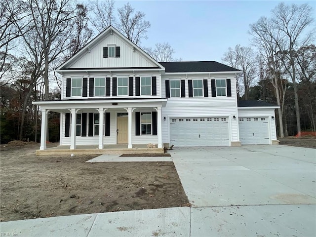 view of front of property with a garage and covered porch