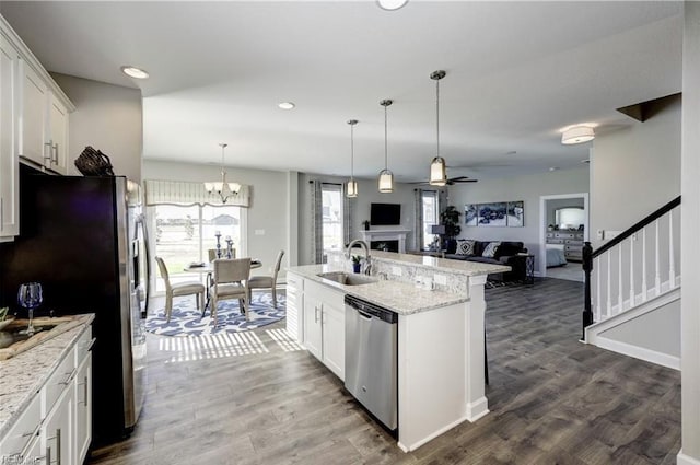 kitchen featuring sink, white cabinets, stainless steel appliances, and dark hardwood / wood-style floors