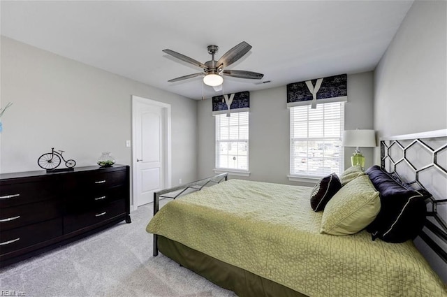 bedroom featuring ceiling fan and light colored carpet