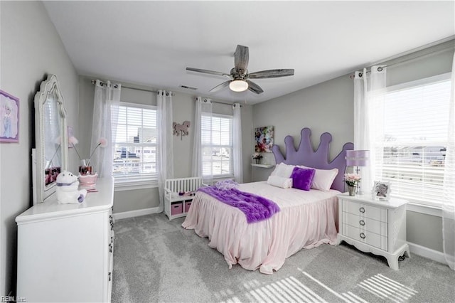 bedroom featuring light carpet and ceiling fan