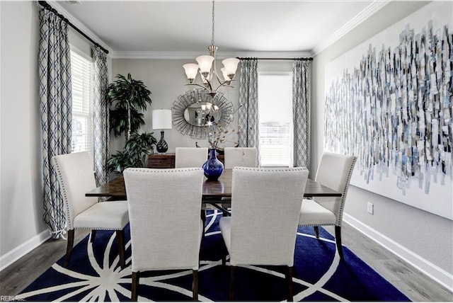 dining area featuring crown molding, dark hardwood / wood-style floors, and a notable chandelier