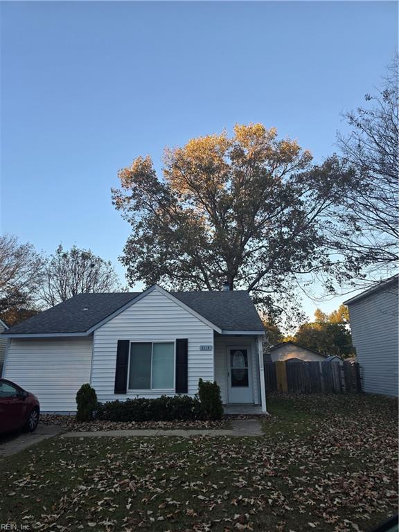 view of front of home featuring fence