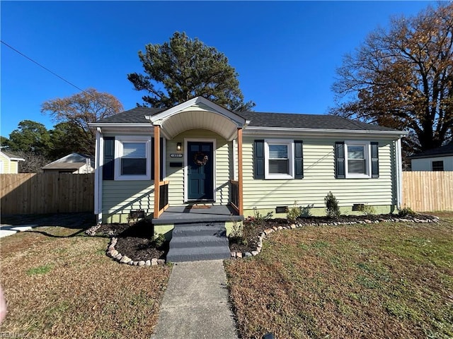 bungalow-style home featuring a front yard