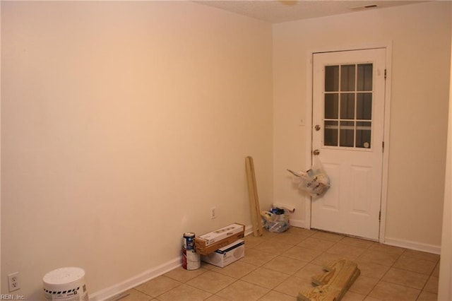 laundry area featuring light tile patterned floors