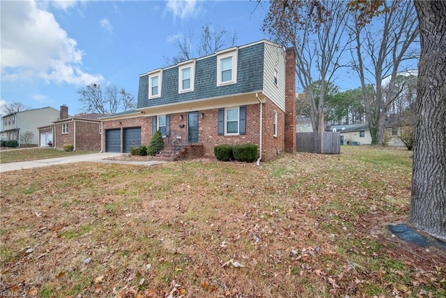 view of front facade with a front yard and a garage