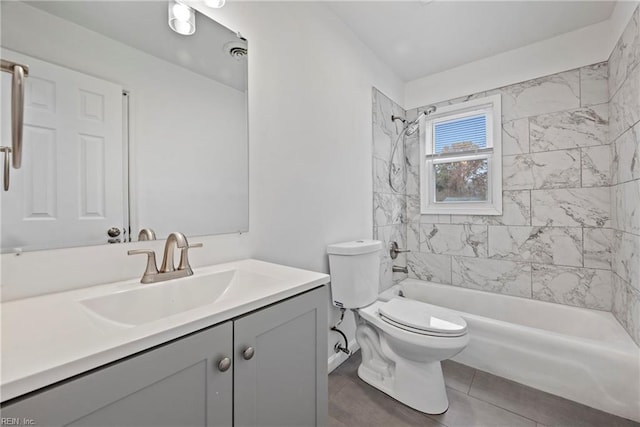 full bathroom with tile patterned flooring, toilet, vanity, and tiled shower / bath