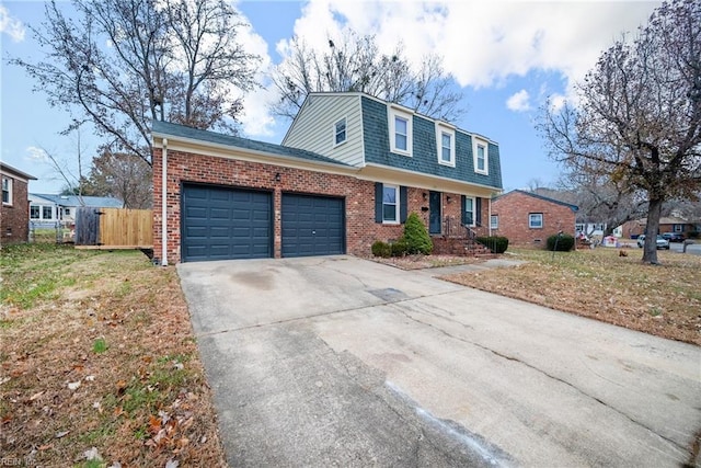 view of front property with a garage and a front lawn