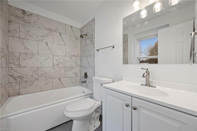 full bathroom with tiled shower / bath combo, toilet, and vanity