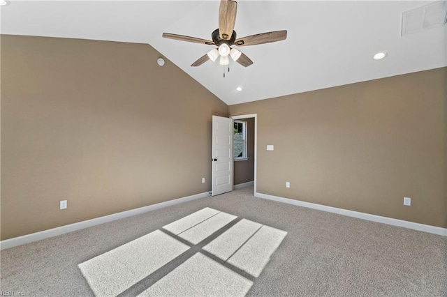 unfurnished bedroom featuring ceiling fan, light colored carpet, and vaulted ceiling