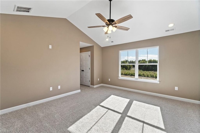 unfurnished room featuring light colored carpet, ceiling fan, and lofted ceiling