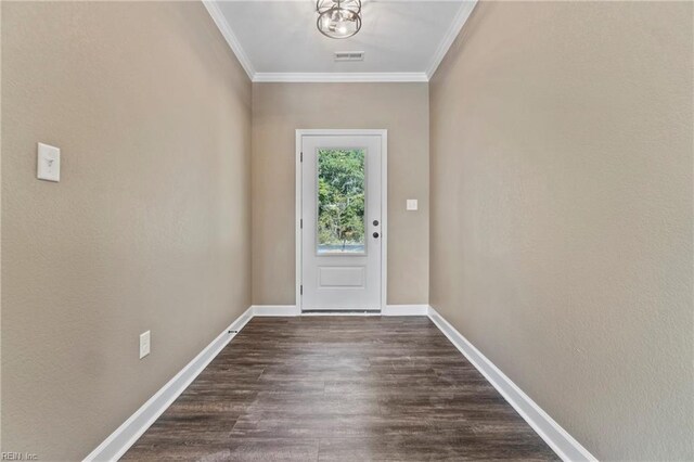 doorway to outside featuring ornamental molding and dark wood-type flooring