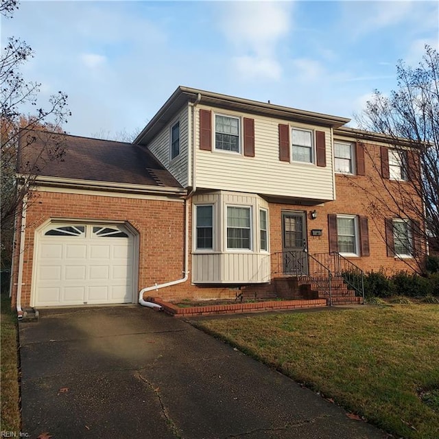 view of front facade with a front lawn and a garage