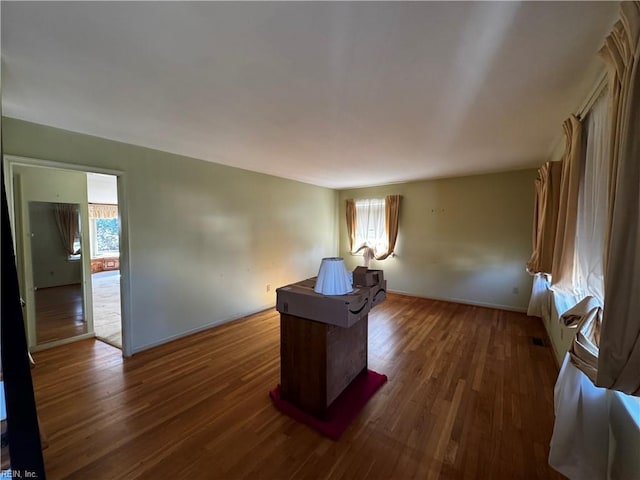 office space with dark hardwood / wood-style floors