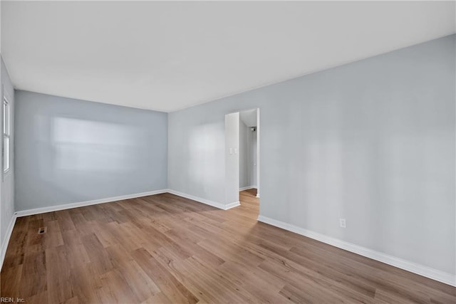 unfurnished room featuring light hardwood / wood-style flooring