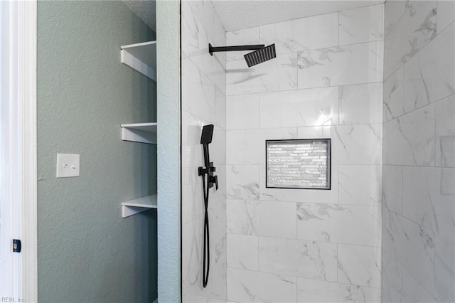 bathroom with tiled shower