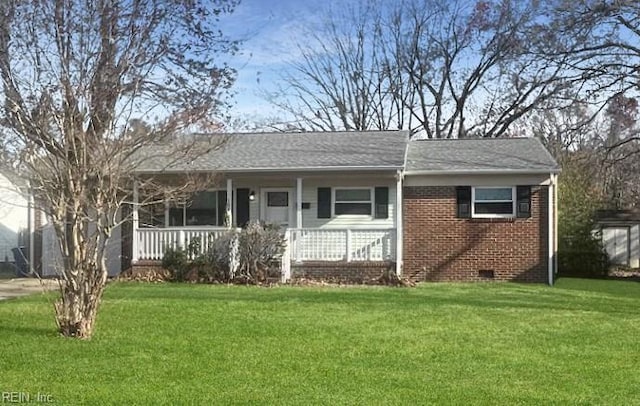 ranch-style home with a front yard, brick siding, covered porch, and crawl space