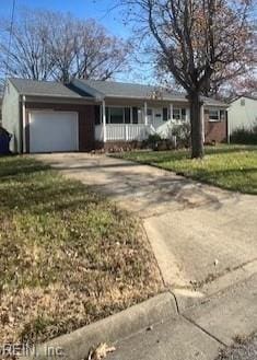 ranch-style house with a garage and concrete driveway