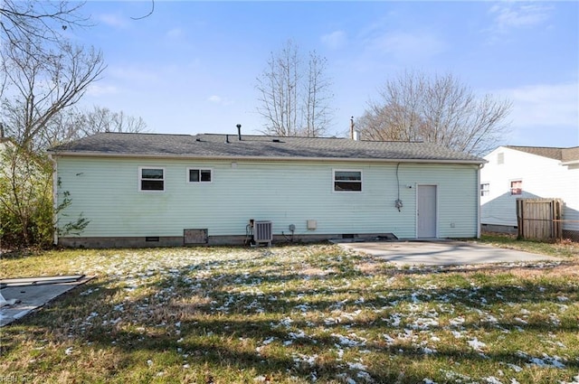 rear view of house with central air condition unit, a patio area, fence, and crawl space