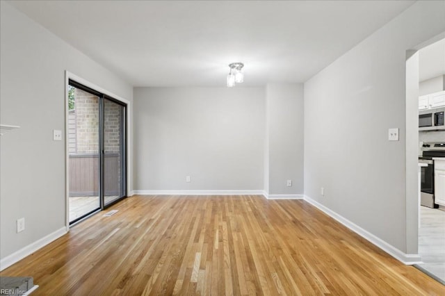 empty room with light wood-type flooring