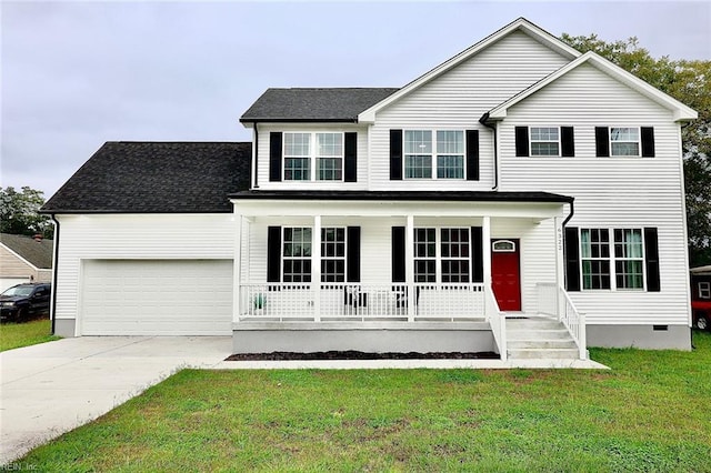 view of front of home with covered porch, a front yard, and a garage