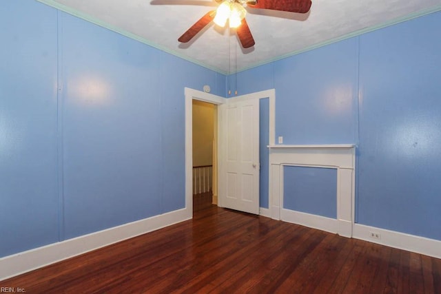 unfurnished room featuring a ceiling fan, crown molding, baseboards, and wood finished floors