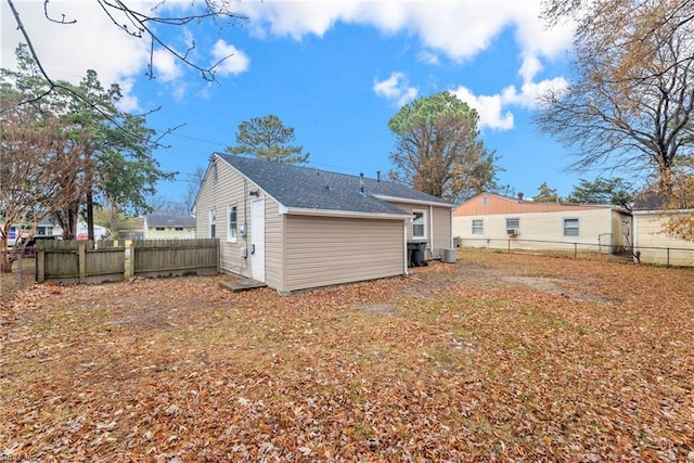 rear view of house with central AC unit