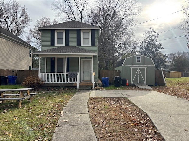 front of property with covered porch and a storage unit