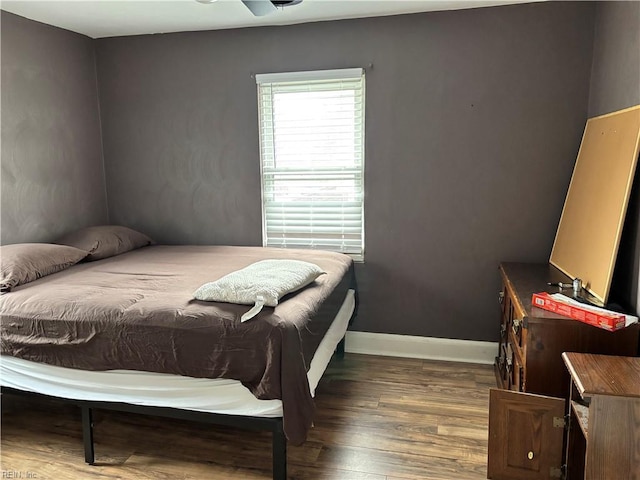 bedroom featuring dark hardwood / wood-style flooring