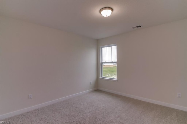 unfurnished room featuring carpet