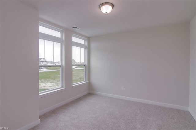 empty room featuring light carpet