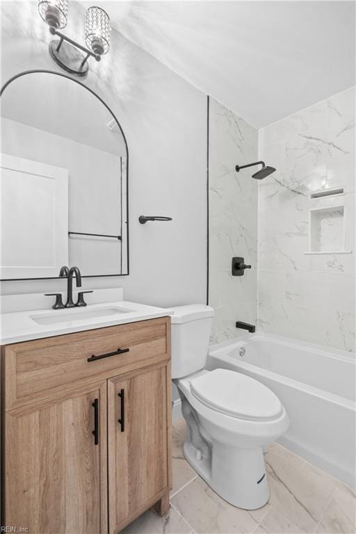 full bathroom featuring vanity, tiled shower / bath combo, and toilet