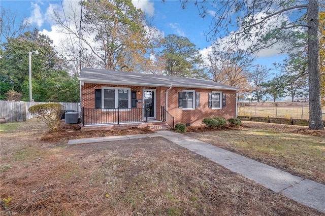 ranch-style home with central air condition unit