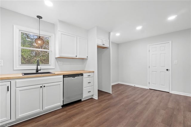 kitchen with white cabinetry, sink, dishwasher, wood counters, and pendant lighting