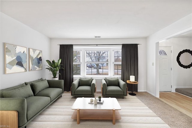 living room with light colored carpet