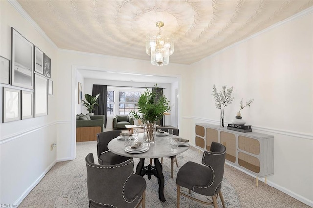 carpeted dining area featuring ornamental molding and a notable chandelier