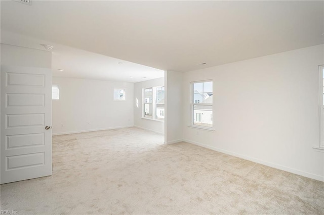 empty room with light colored carpet