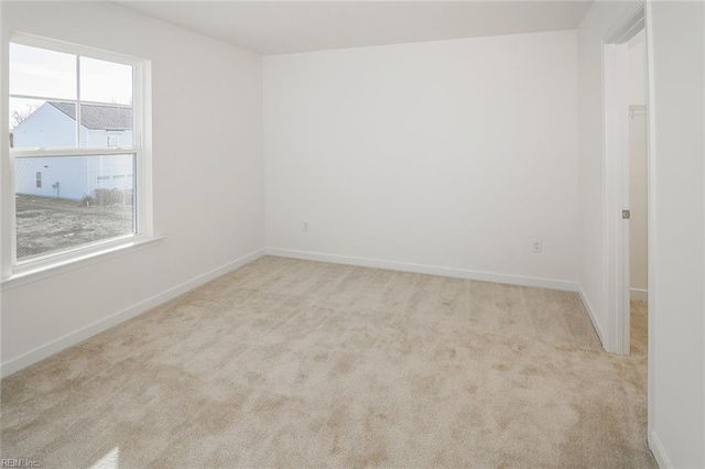 spare room with light carpet