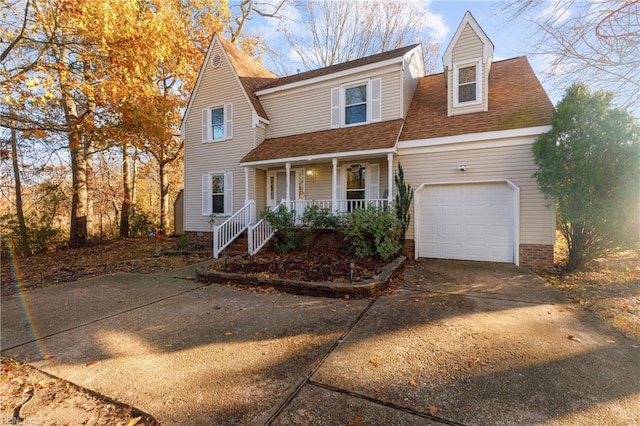 view of front of home with covered porch and a garage