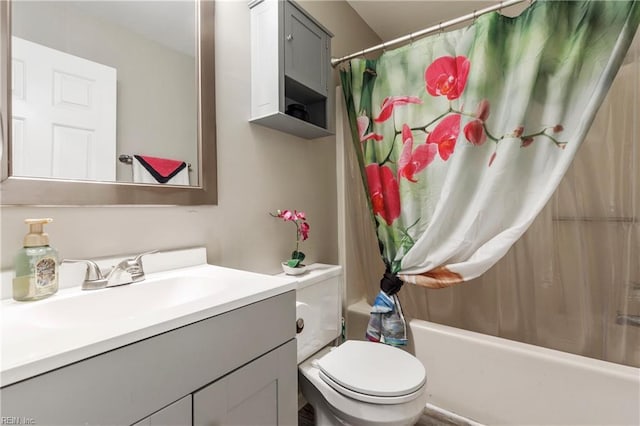 full bathroom with vanity, shower / bath combination with curtain, and toilet