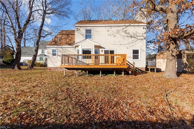 rear view of property with a wooden deck