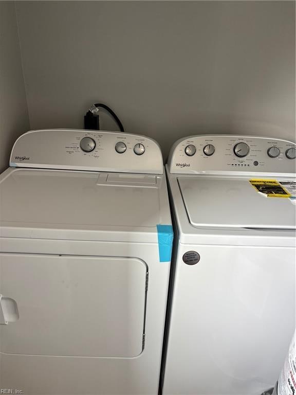 laundry room with separate washer and dryer