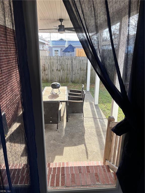 view of patio featuring ceiling fan