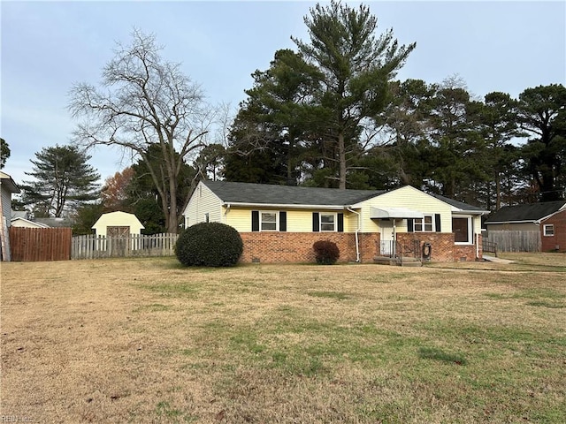 ranch-style house featuring a front lawn