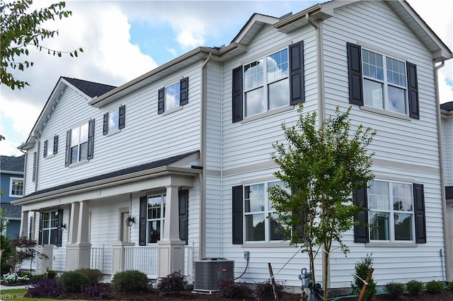 view of front of home with central AC and a porch