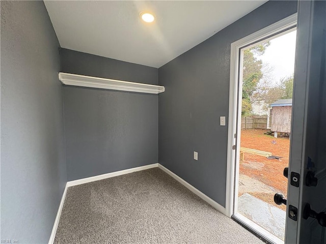 doorway featuring carpet flooring