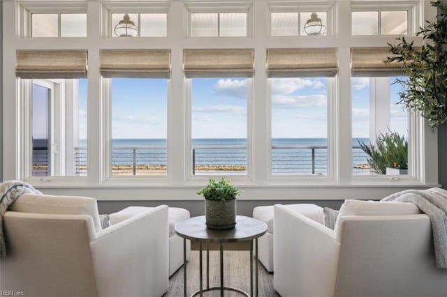 sunroom / solarium with a water view