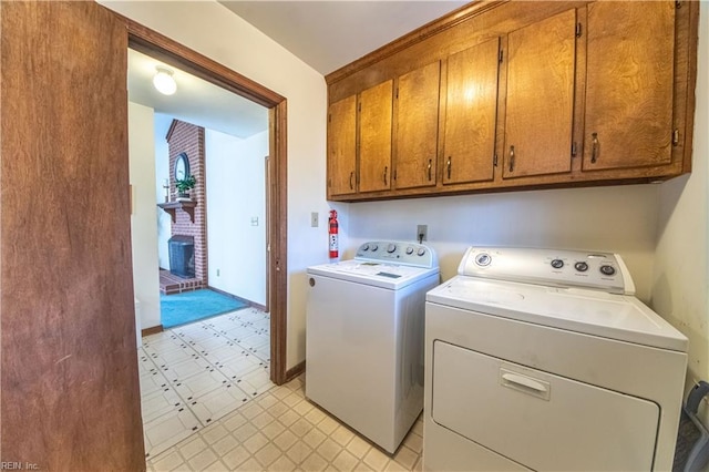 laundry room featuring cabinets and independent washer and dryer