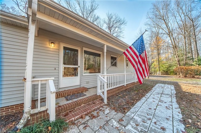 entrance to property featuring a porch