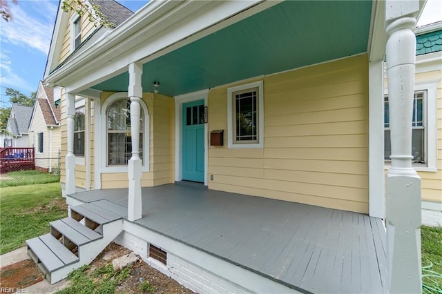 property entrance featuring a porch